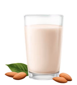 A clear glass filled with almond milk, surrounded by whole almonds and green leaves.