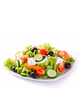 A fresh garden salad with lettuce, tomatoes, cucumbers, olives, bell peppers, and feta cheese on a white plate.